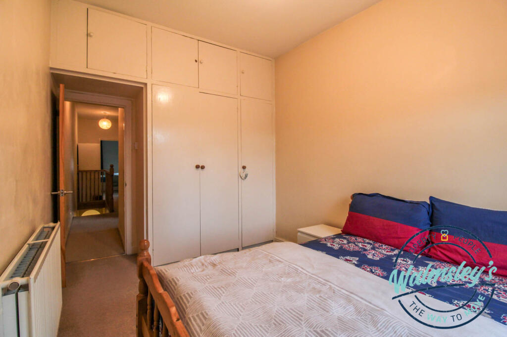 Rear bedroom with storage