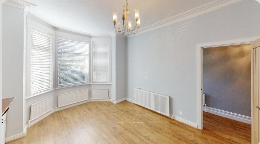 Bright and airy living room featuring a large b...