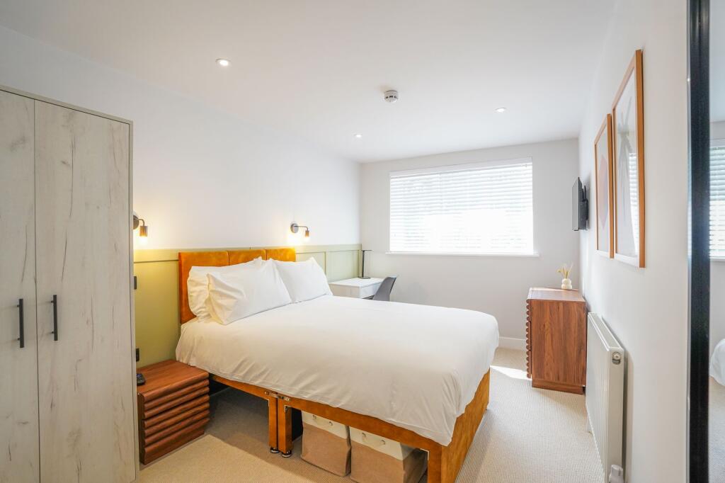 Bright and inviting double bedroom featuring a ...