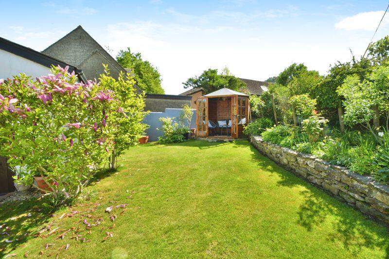 Area of lawn, attractive borders, and...