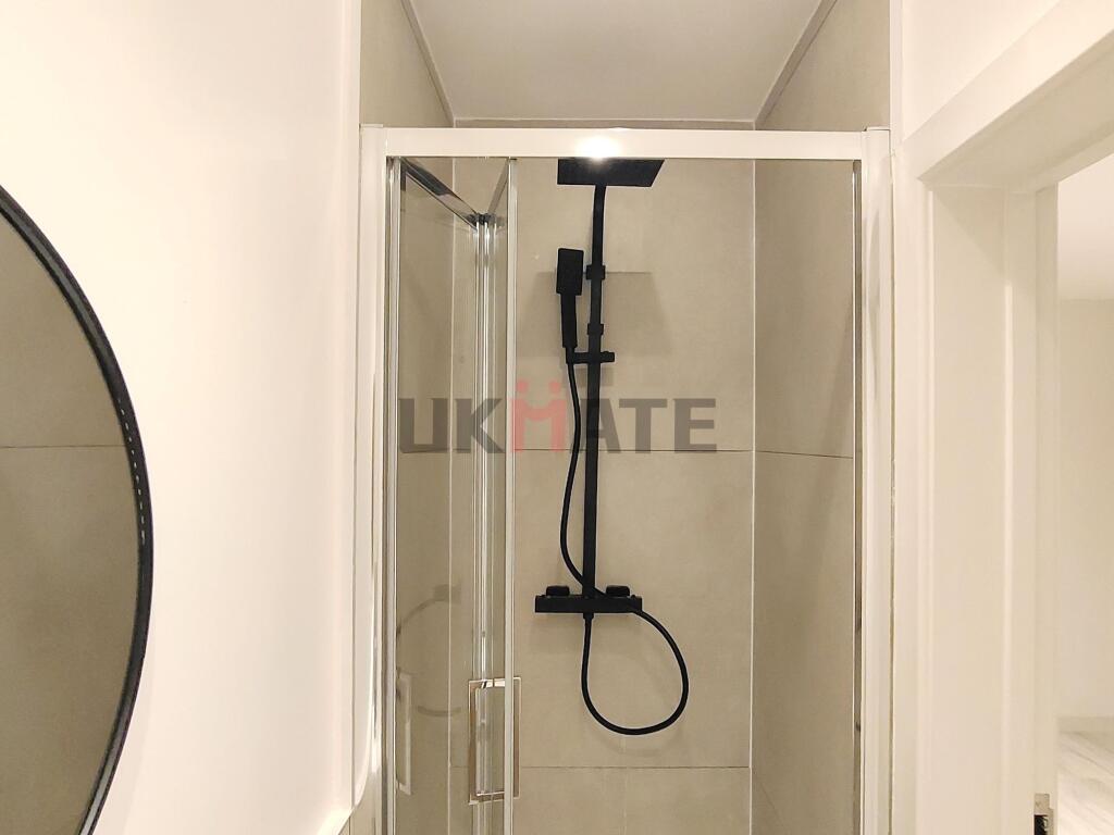 A clean and modern bathroom featuring a sleek s...