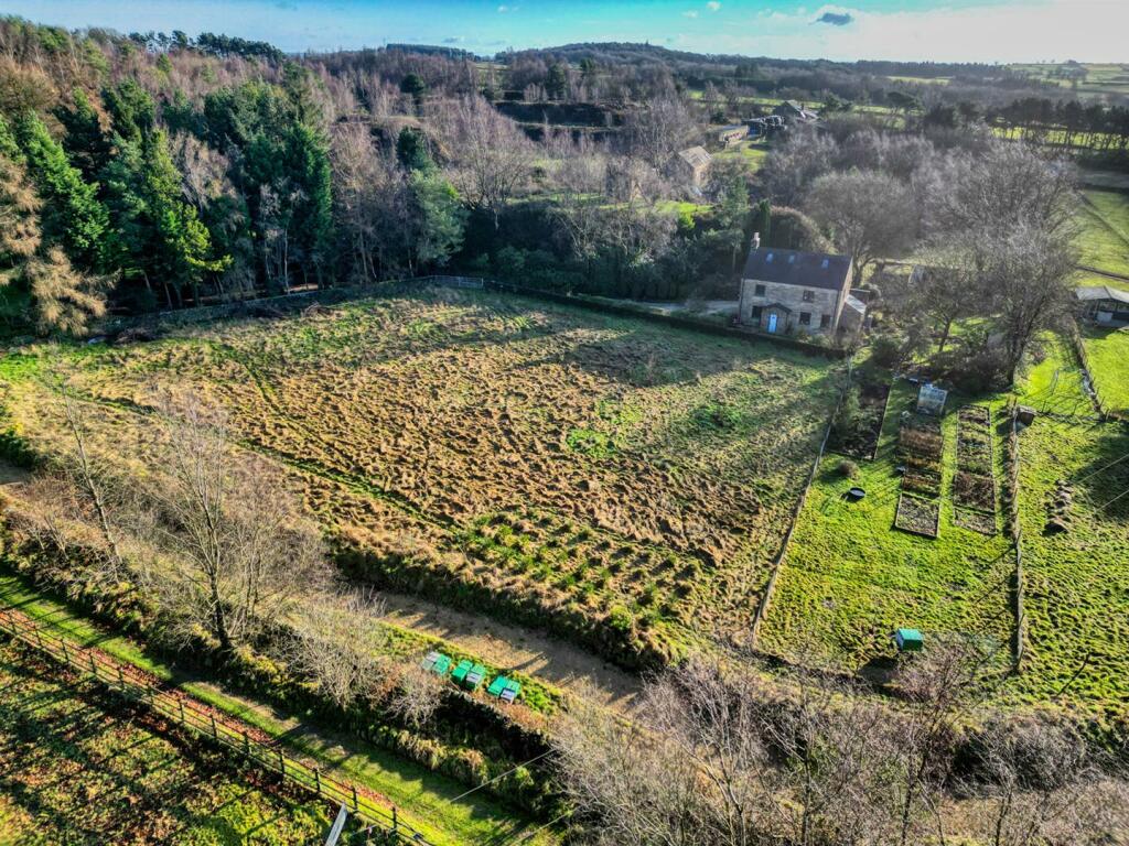 Front of the home towards drive and woodland.jpg