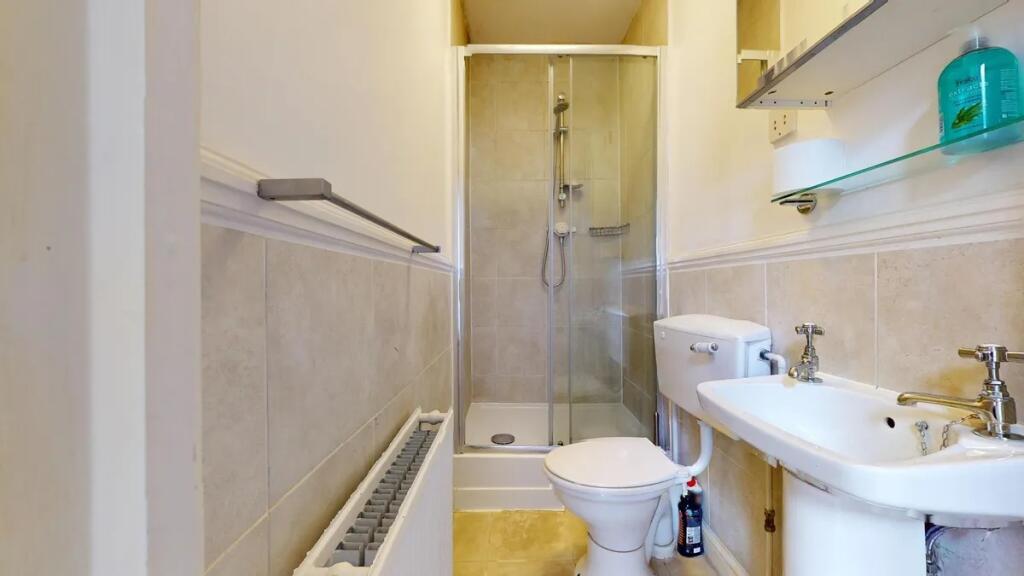 A clean and well-maintained bathroom featuring ...