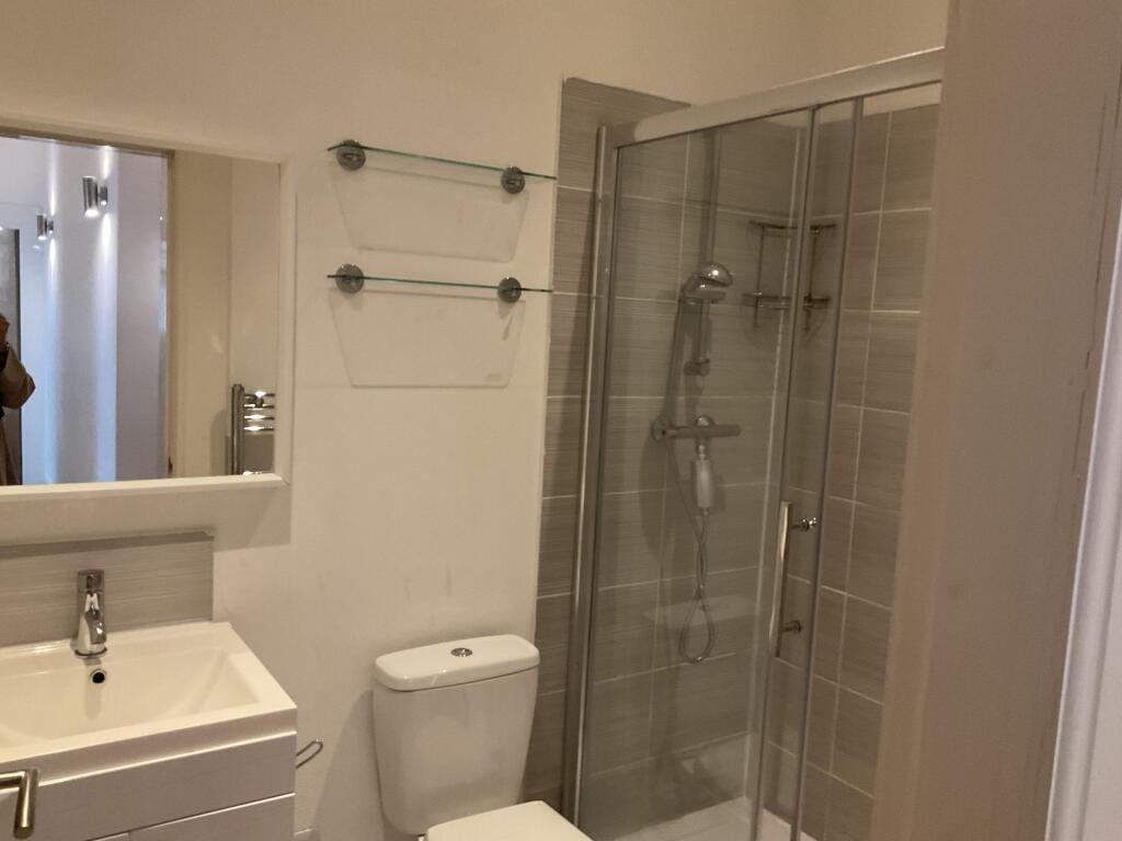 A modern and well-maintained bathroom featuring...