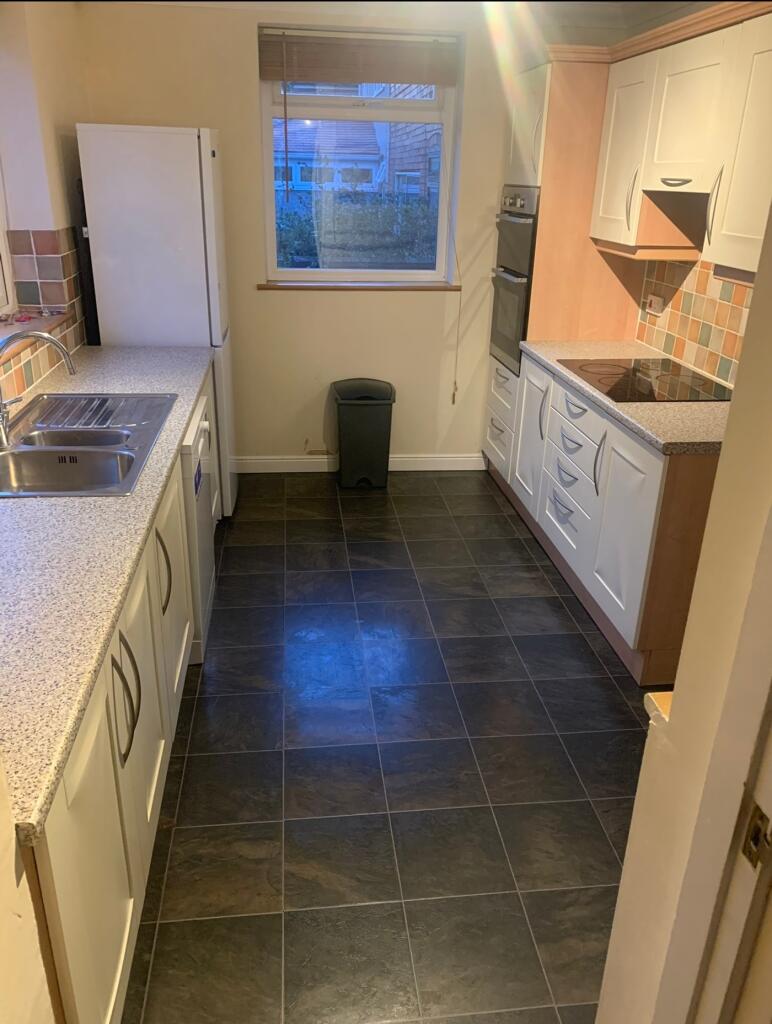 A functional kitchen with ample counter space a...