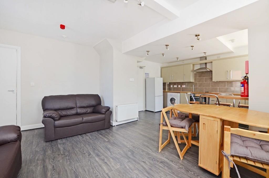 A bright and inviting living room featuring com...