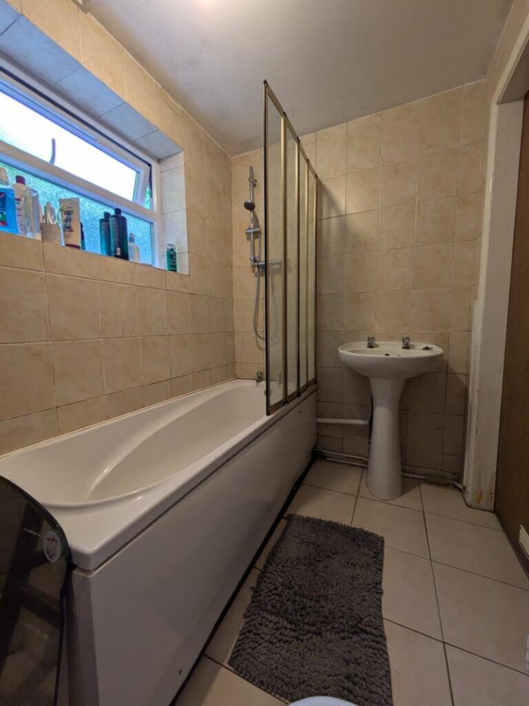 A clean and well-maintained bathroom featuring ...