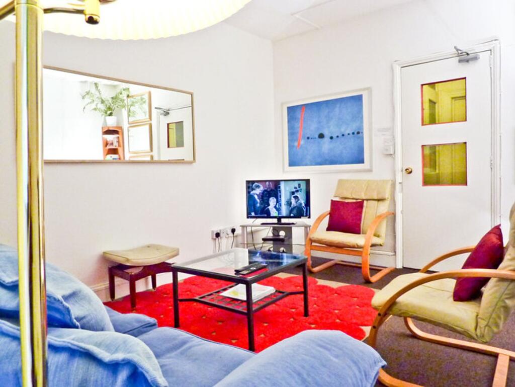 A cozy living room with comfortable seating and...