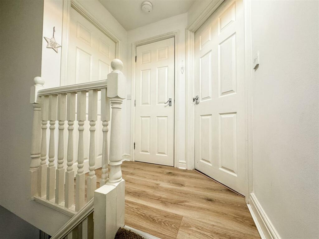 STAIRS RISING TO THE SECOND FLOOR LANDING