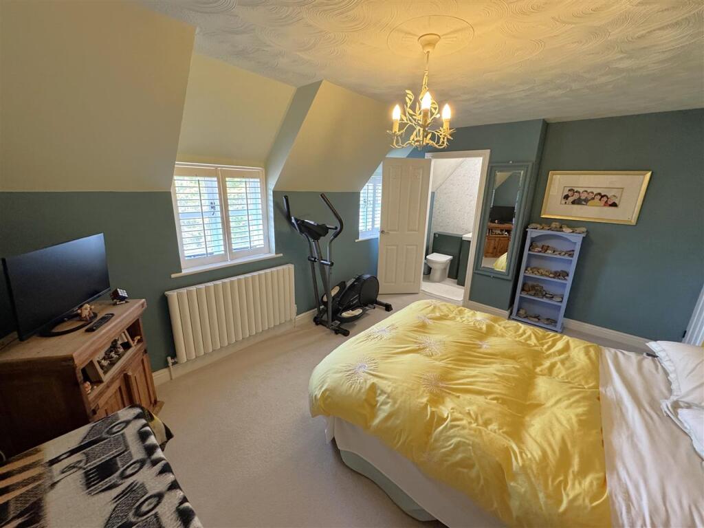 Bedroom Two leading through to the en-suite cloakr