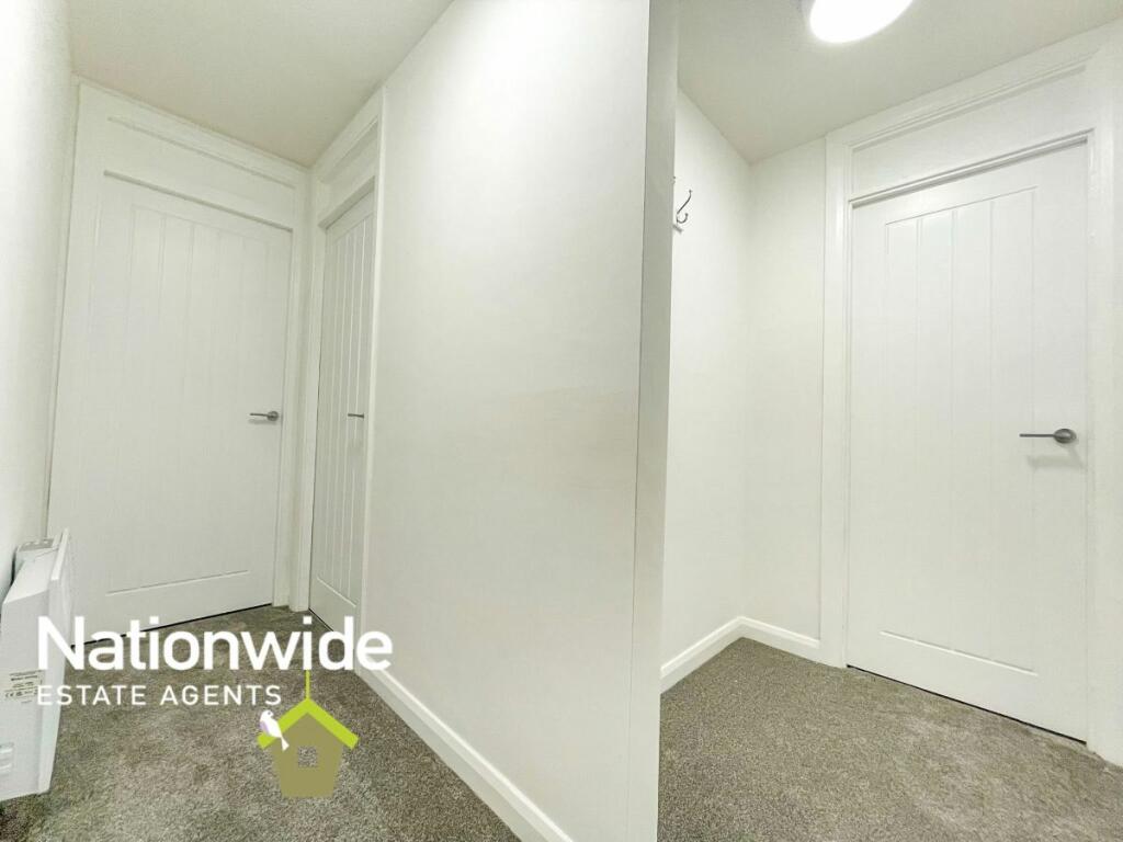Hallway looking at Bathroom, Cupboard and Bedroom