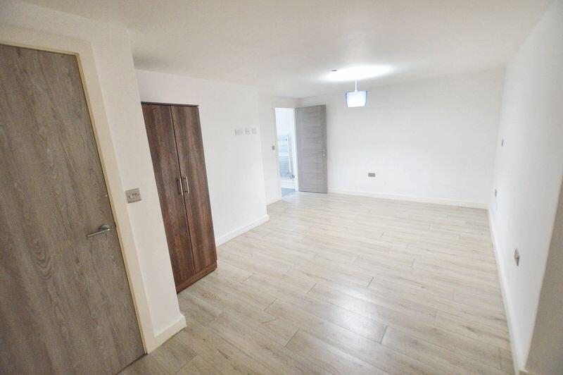Bright and spacious double bedroom featuring li...
