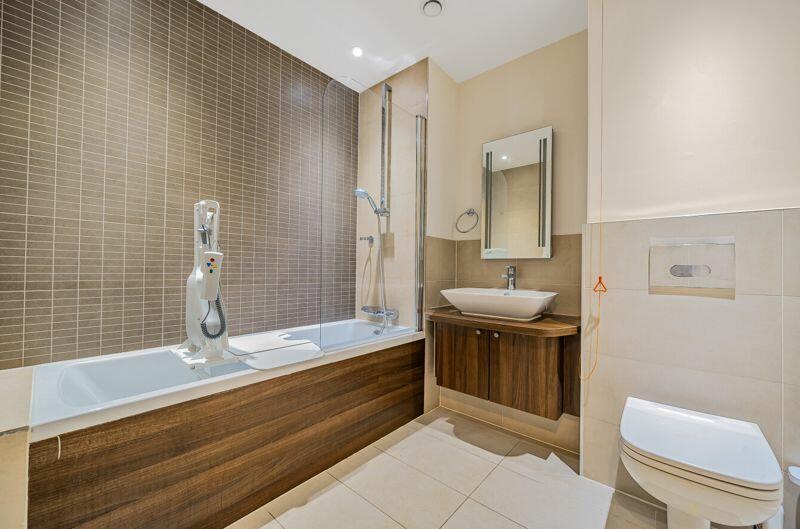Bathroom with over-bath shower