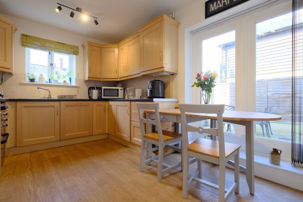 Sunny kitchen, doors to garden