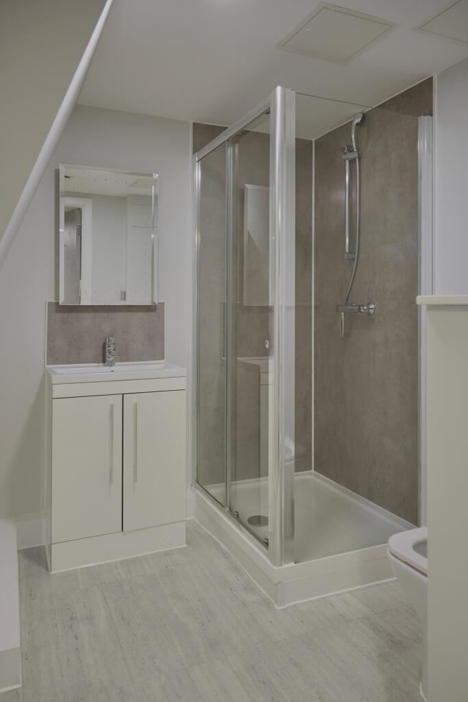 A modern and clean bathroom featuring a spaciou...