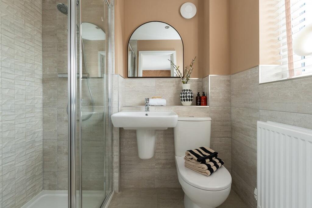 Bedroom 1 is complete with its own private ensuite