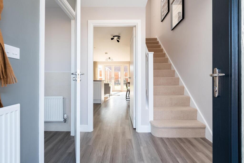 The entrance hall leads through to the open plan downstairs living space