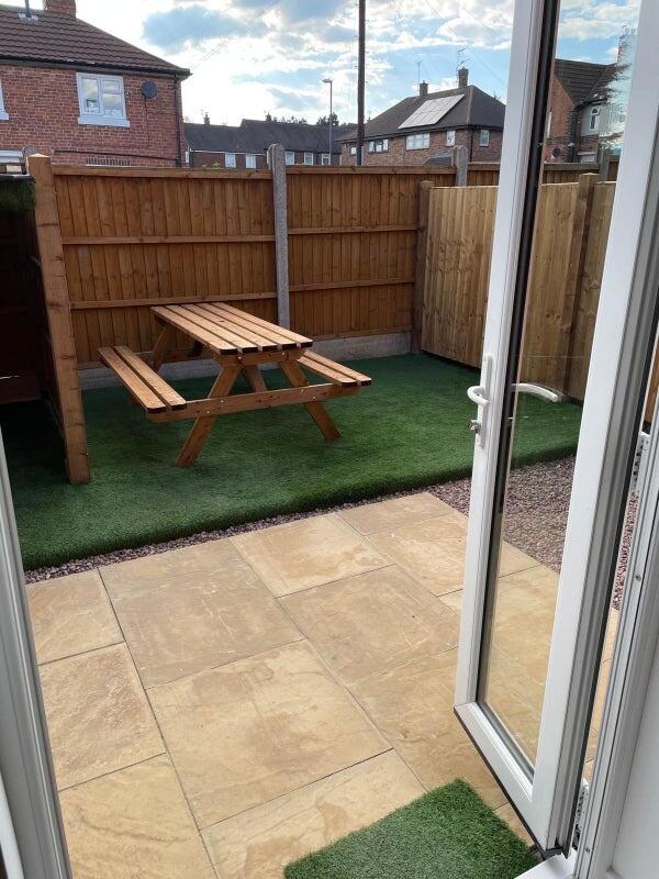 Bright and well-maintained garden area featurin...