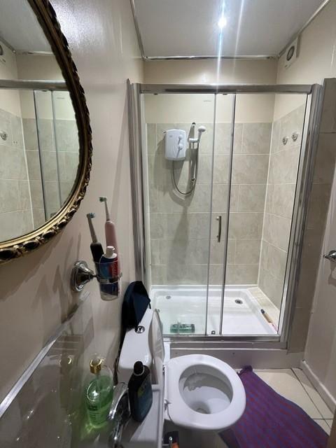 A clean and well-maintained bathroom featuring ...