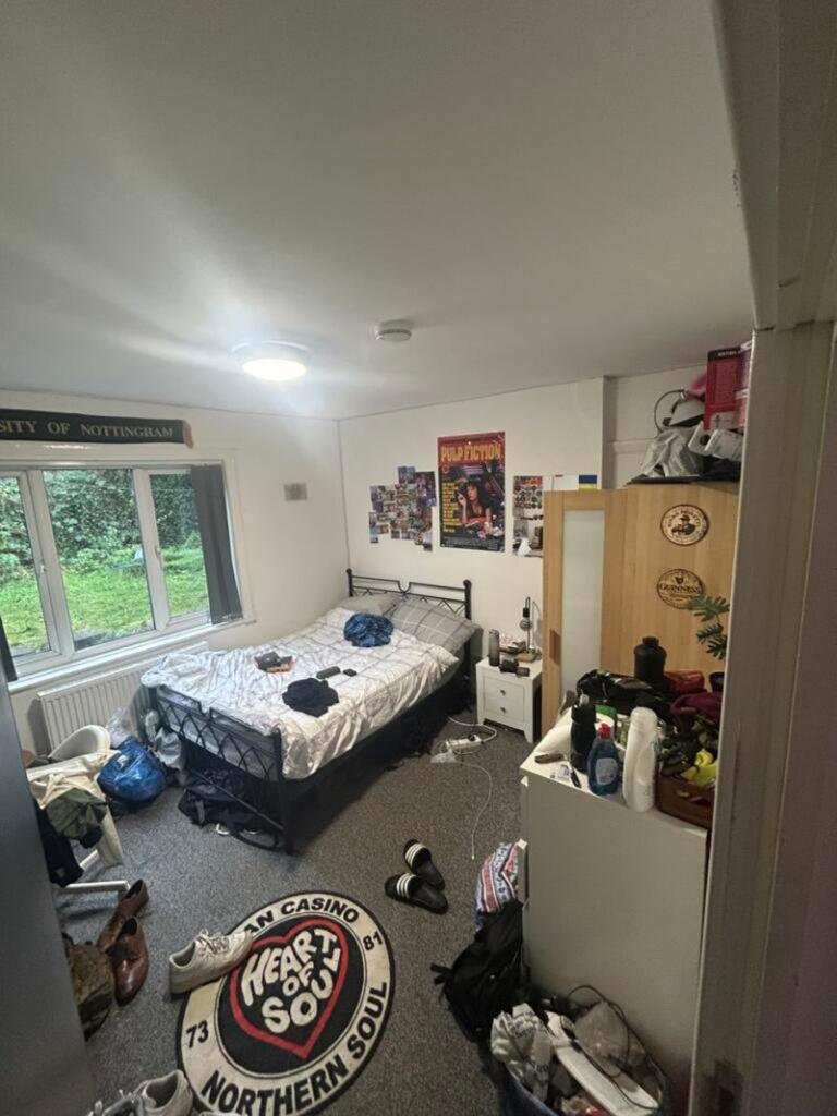 A spacious double bedroom with ample room for p...