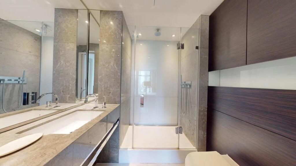 A modern and sleek bathroom suite featuring a s...