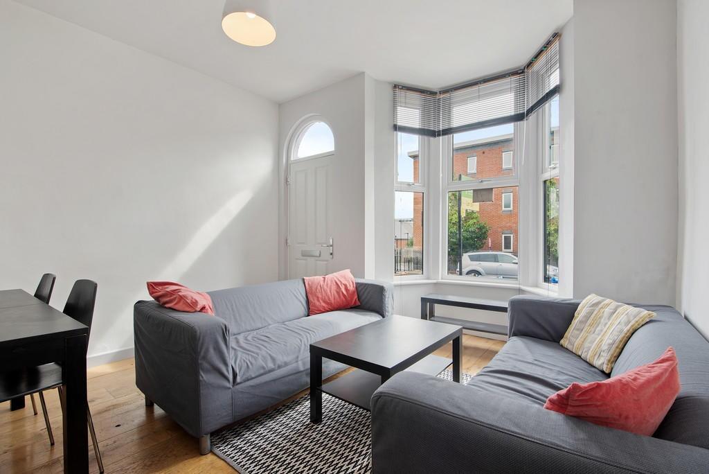 Bright and inviting living room featuring comfo...