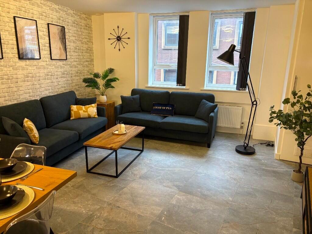 A modern and inviting living room featuring two...