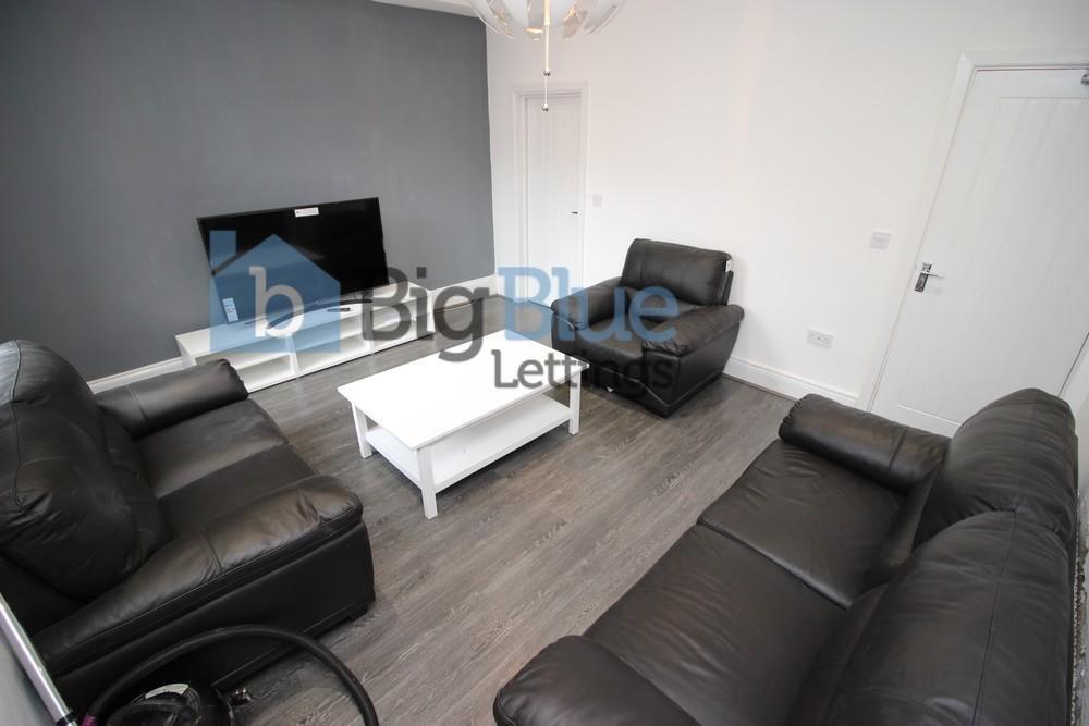 A stylish and comfortable living room featuring...