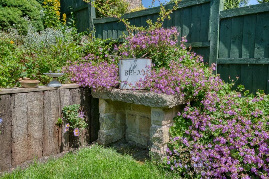 Rear Garden - stone bench.jpg