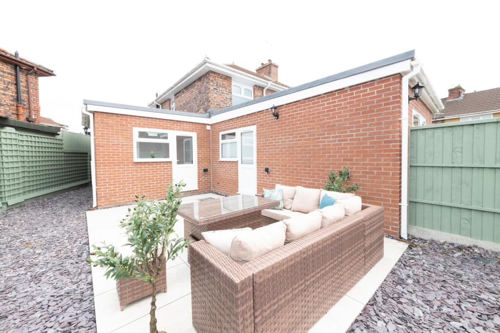 A beautifully designed garden area featuring st...