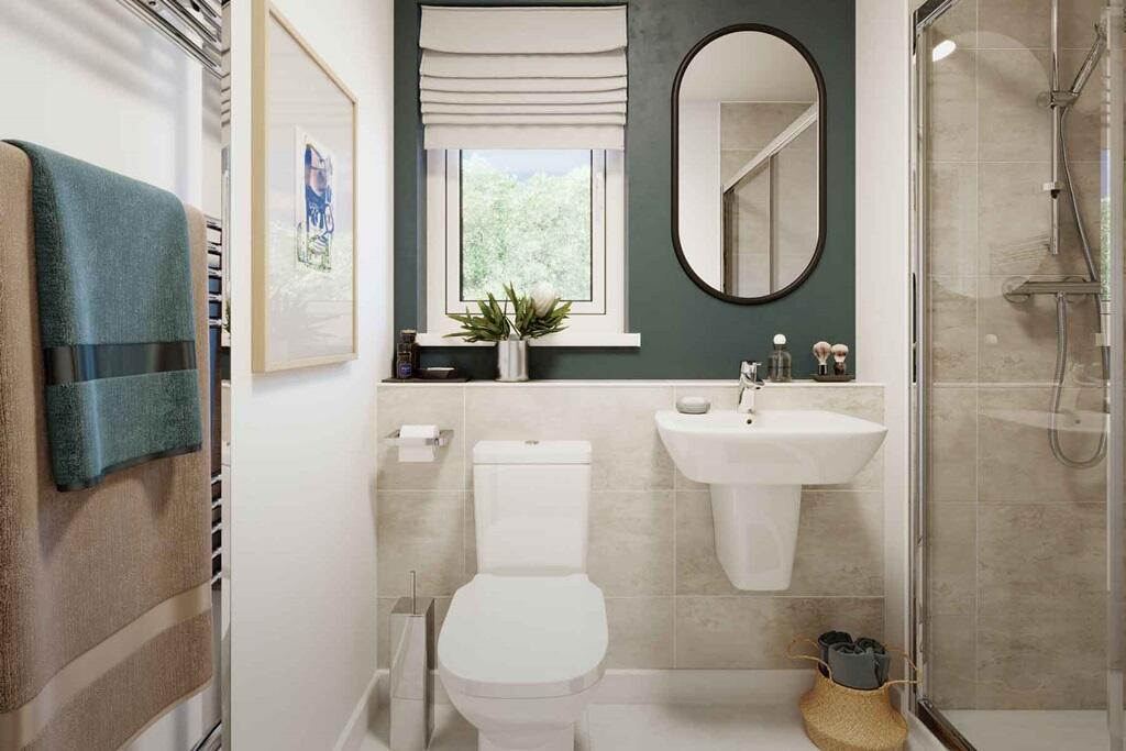 An en-suite with full width shower cubicle