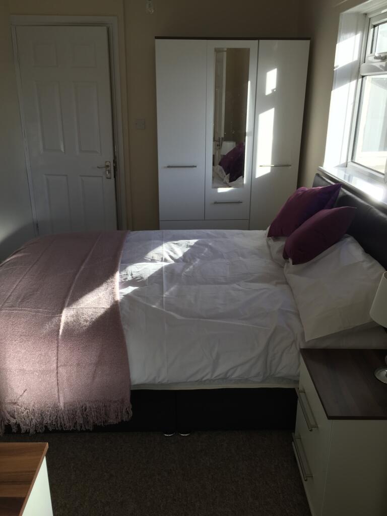 This charming double bedroom features ample nat...