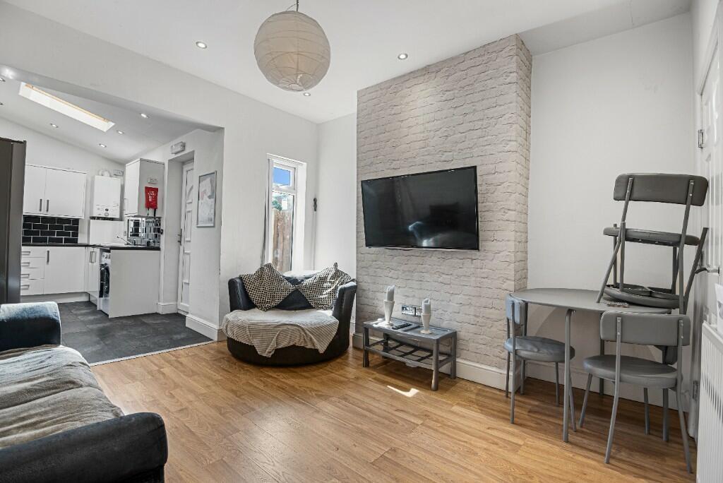Contemporary living room with a modern open-pla...
