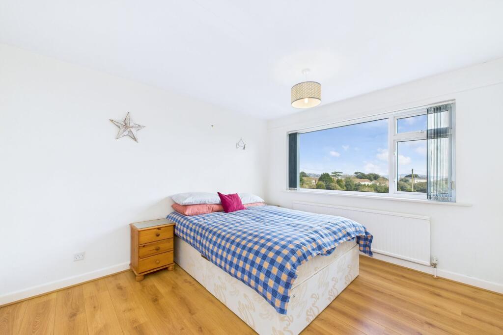 Bedroom two on ground floor with sea views