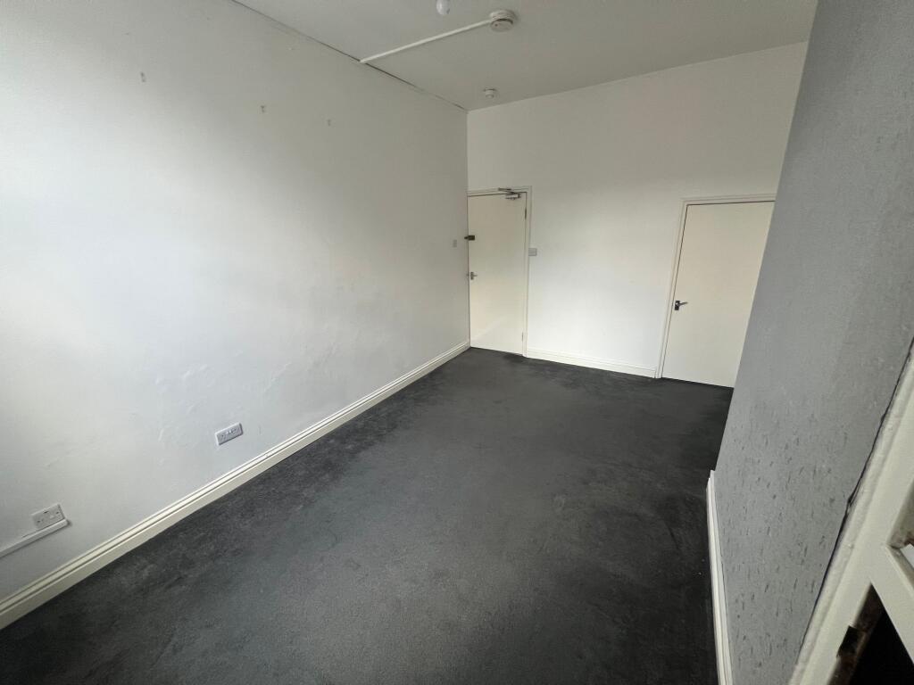 A clean and well-maintained hallway featuring n...