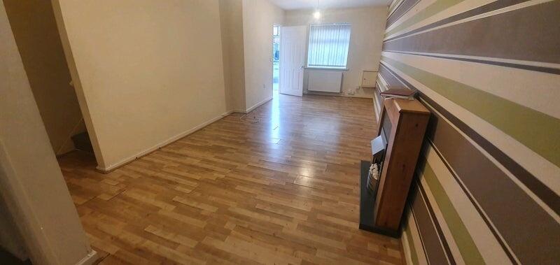 Spacious living room featuring wooden flooring ...