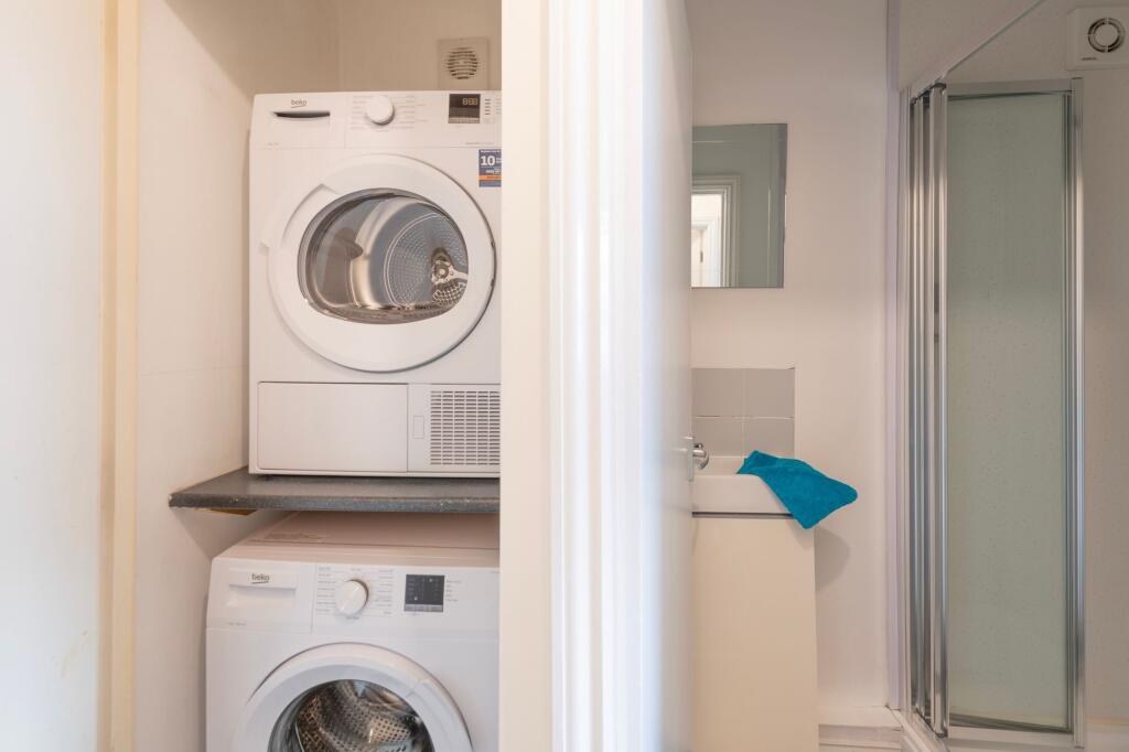 Bright and clean bathroom featuring a modern si...