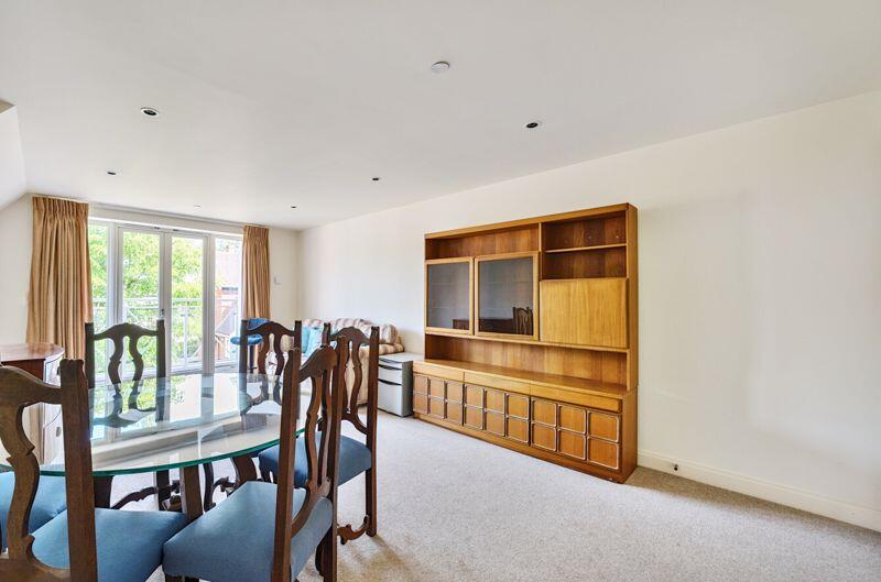 Living/dining room with balcony access