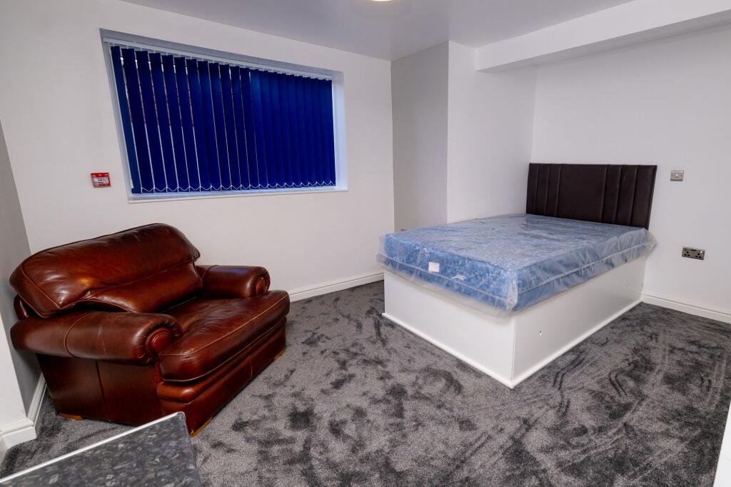 A modern living space featuring a comfortable l...