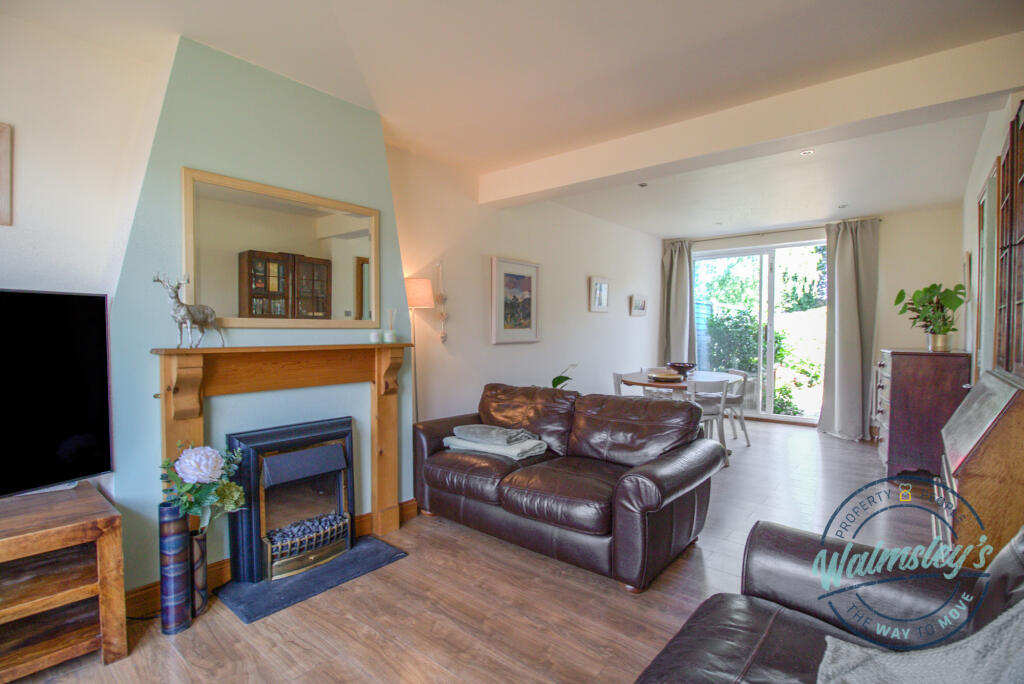 Sitting &amp; dining room with sliding doors to garden