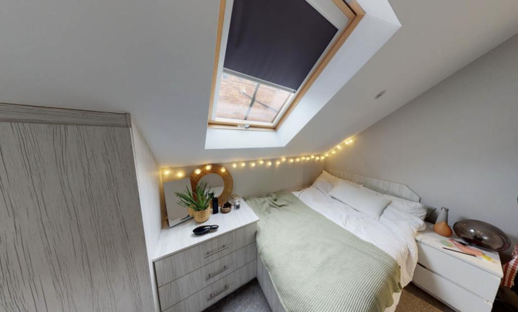 A bright and spacious master bedroom featuring ...