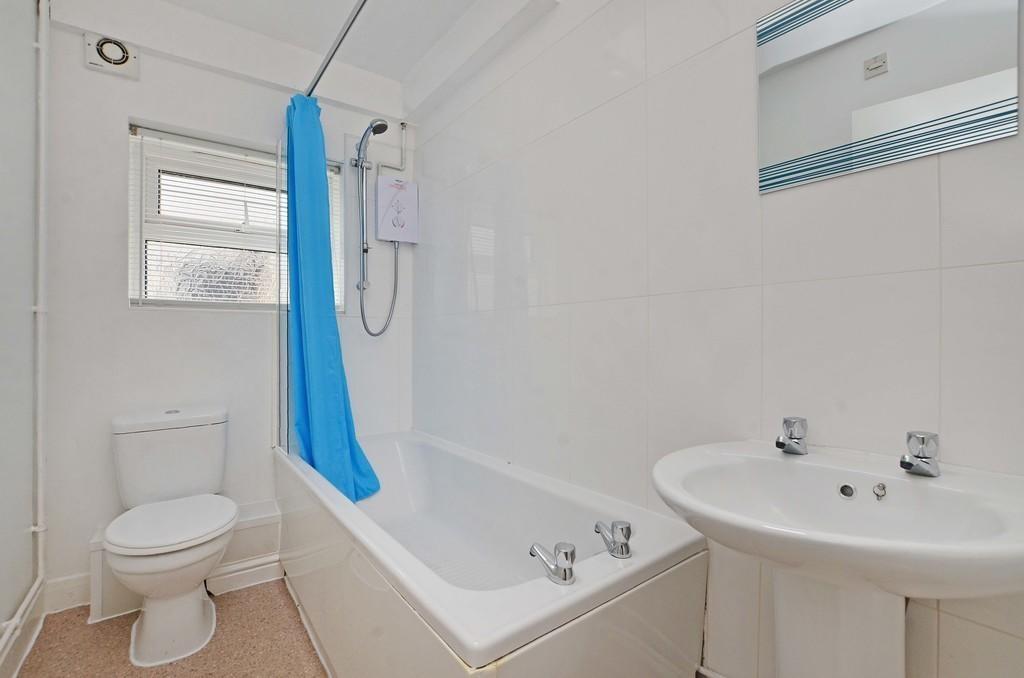 A clean and well-maintained bathroom featuring ...