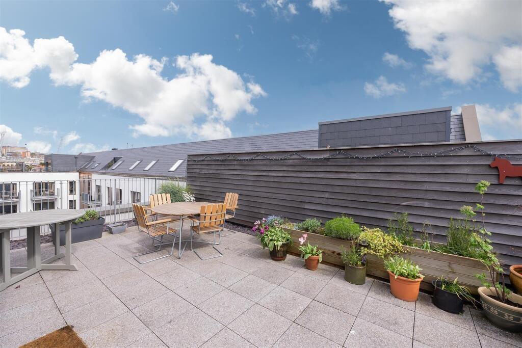 Spacious rooftop garden terrace with ample natu...