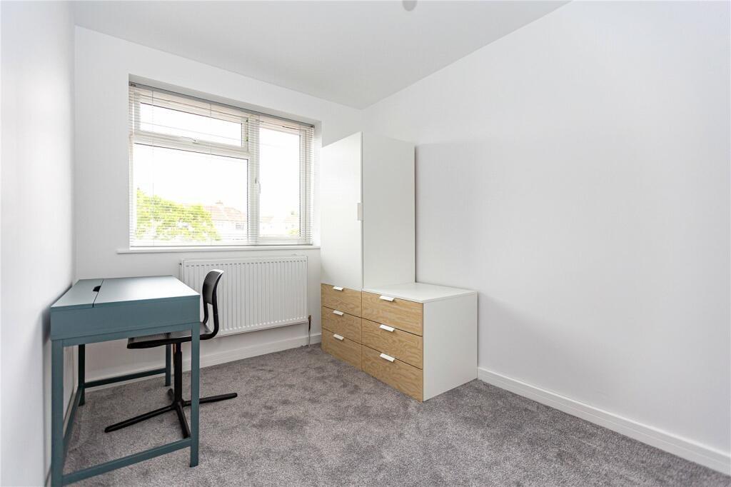 A bright and tidy single bedroom featuring a la...