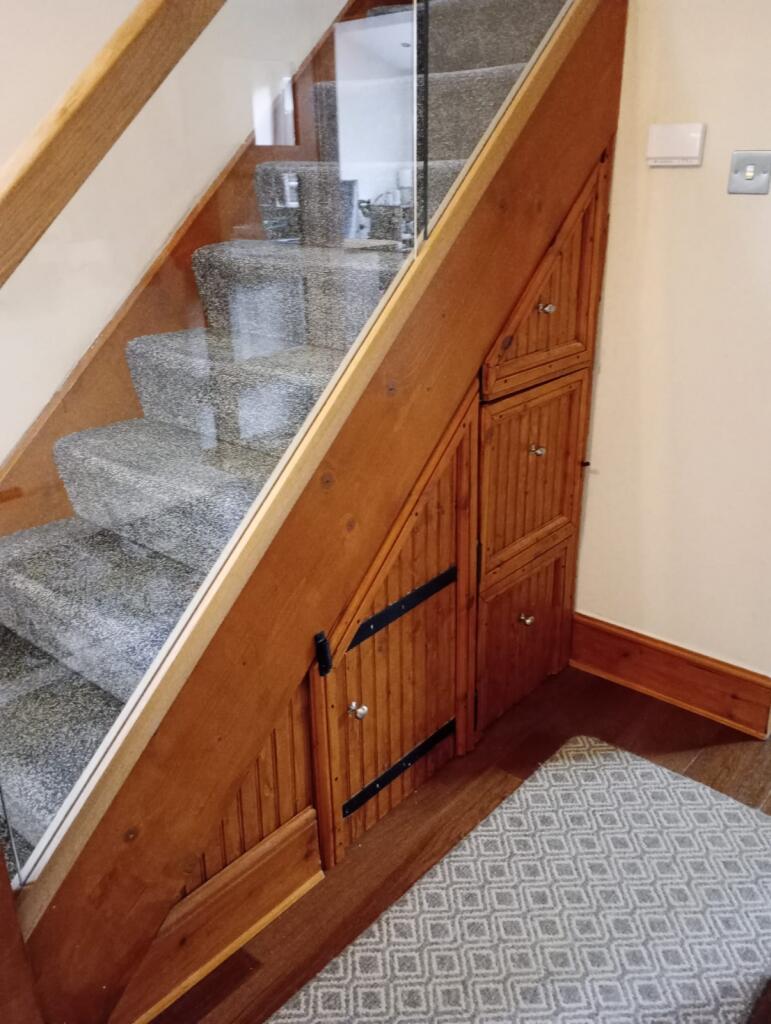 A neat and well-maintained staircase area with ...