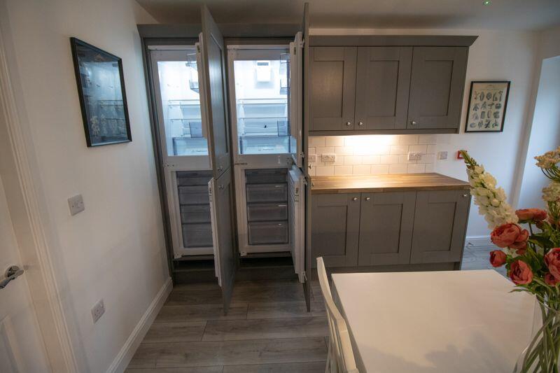Integrated double fridge freezer