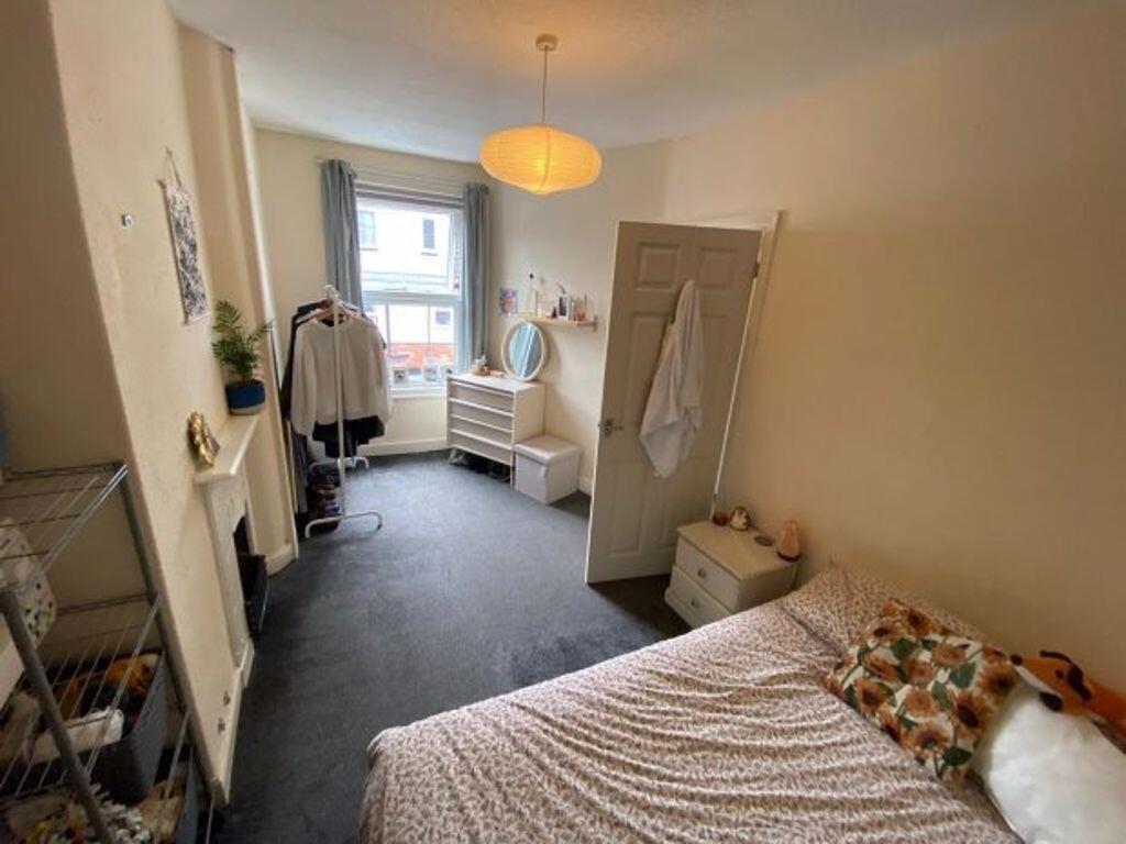 A clean and bright single toilet room with natu...