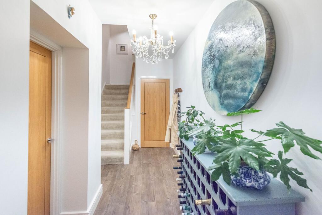 INNER APARTMENT ENTRANCE AND STAIRWELL TO BEDROOMS