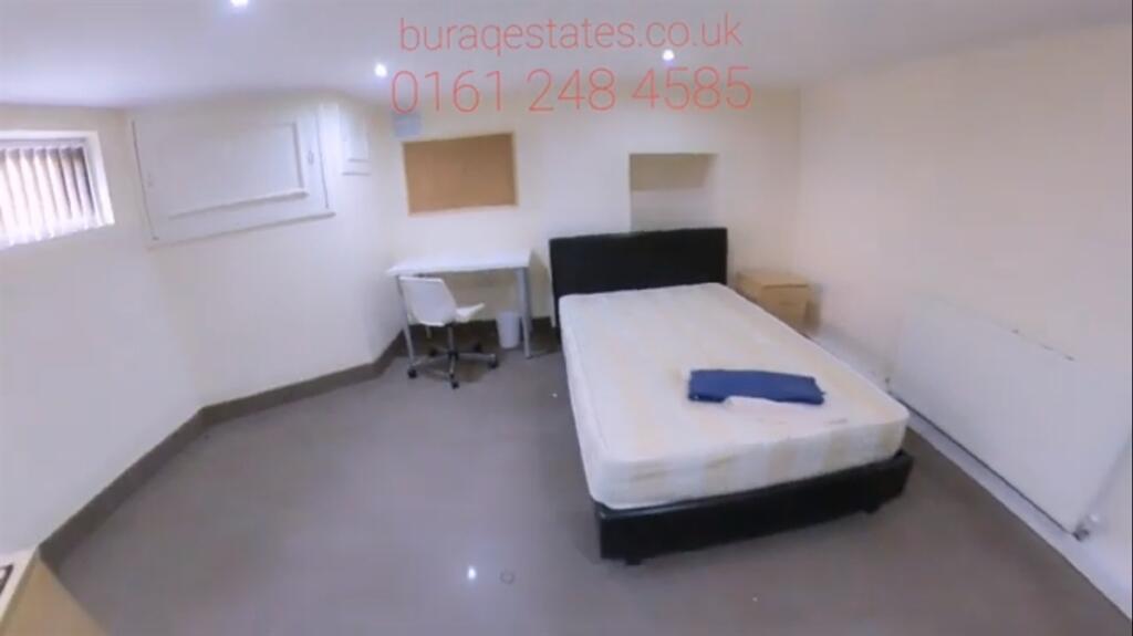A tidy double bedroom with a comfortable bed, s...