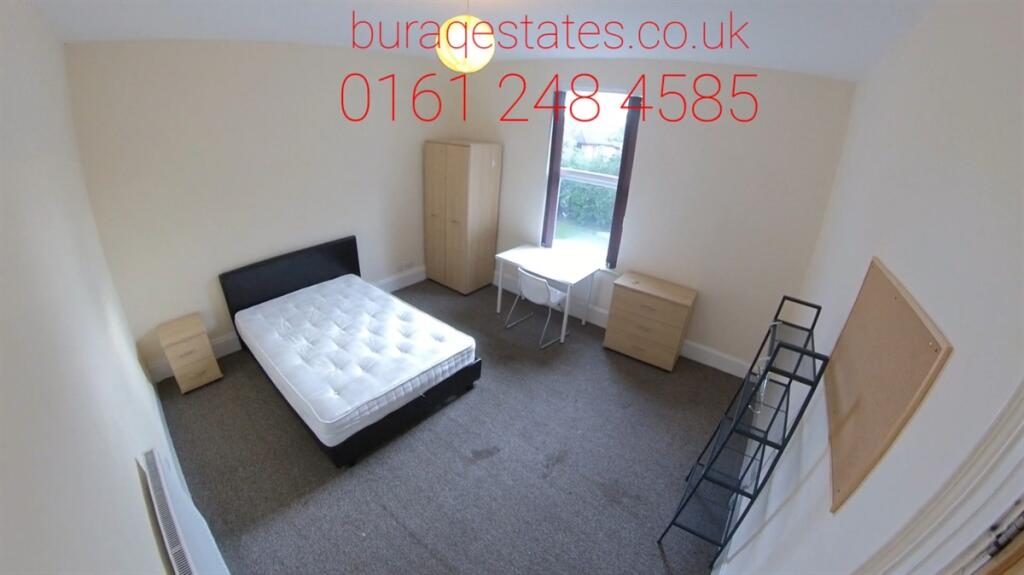 A bright and tidy double bedroom with a comfort...